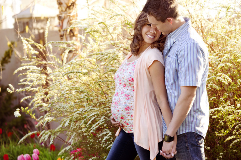 Maternity Pictures almost kiss holding hands