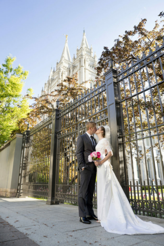 Salt Lake Temple Groom kissing bride