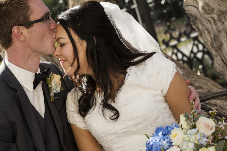 Groom Kissing Forehead of Bride