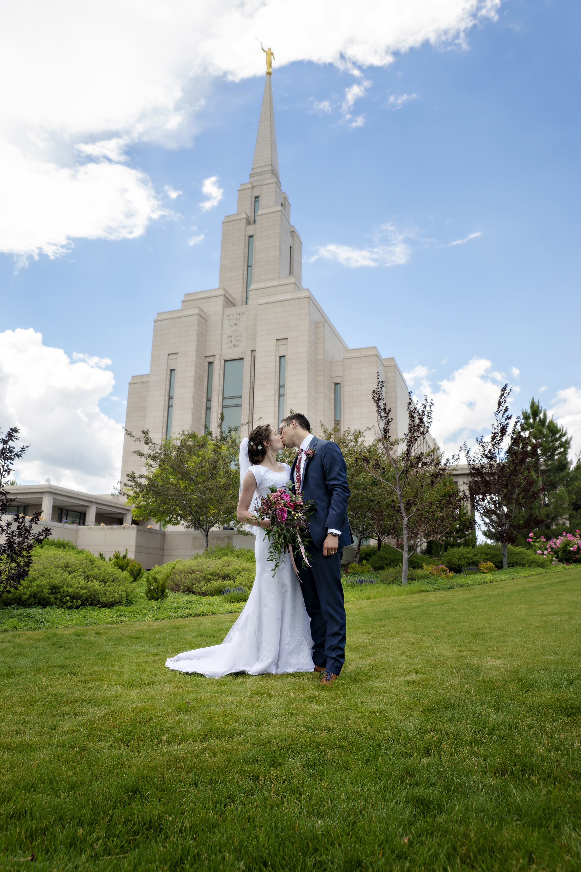 Bride and Groom kissing at Oquirrh Mountain Temple