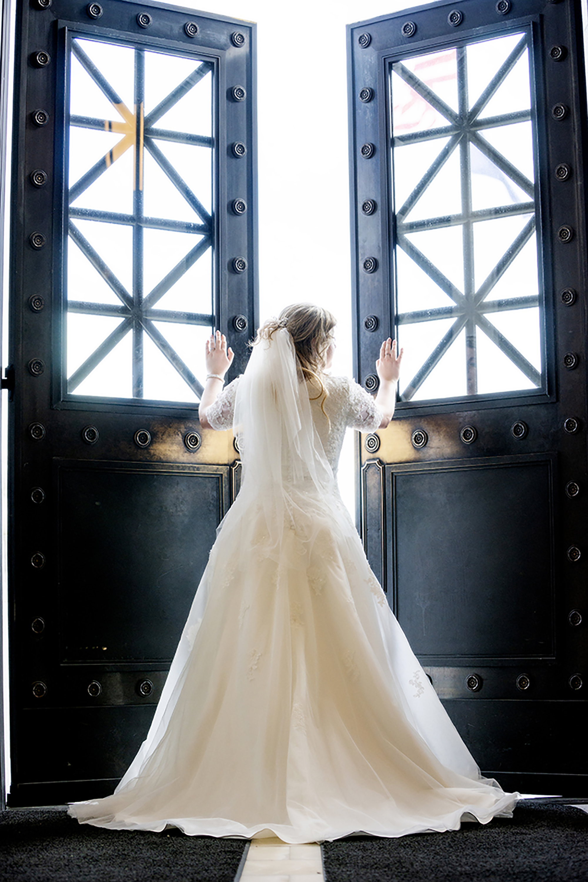 Bride opening doors