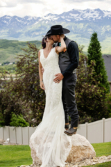 Bride and Groom kissing with Rocky Mountain view
